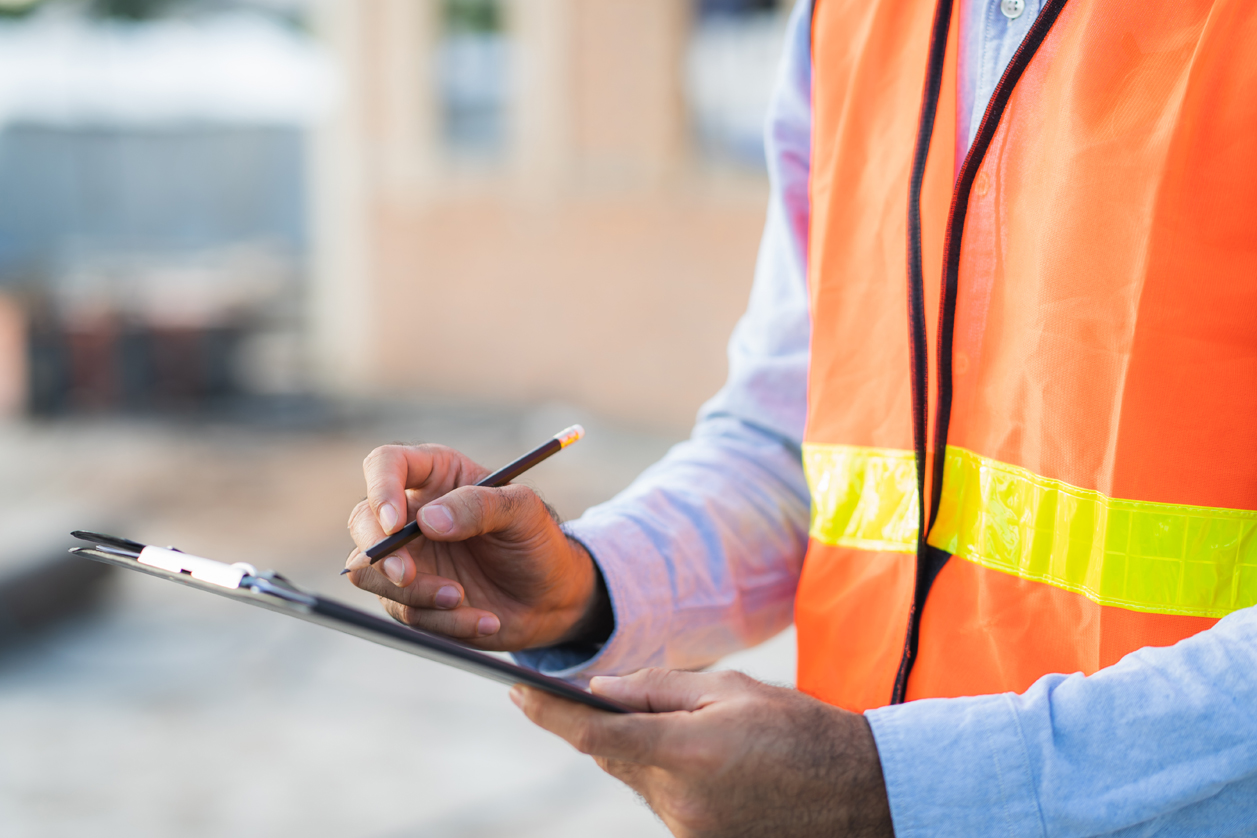 WHO ARE WE louisiana insurance adjuster with clipboard at home after storm